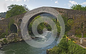 The roman bridge, Cangas de Onis, Asturias, Spain photo